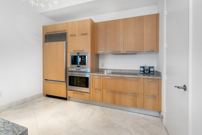 Top of Line Custom Cabinetry - 15901 Collins Ave