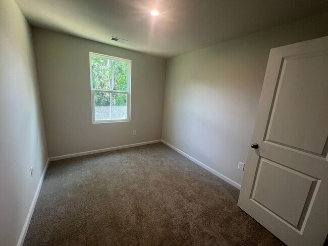 Building Photo - New Three-Bedroom, Two and one-half Bath T...