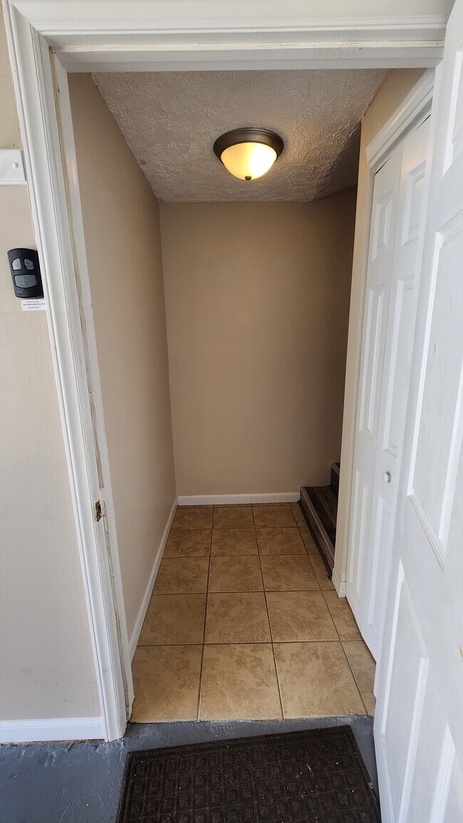 bottom landing of stairs from garage - 833 Plantation Dr