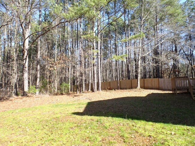 Building Photo - Great location, large wooded and fenced ya...