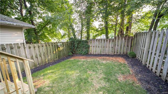 fenced in shaded back yard with covered back porch - 908 Porter St