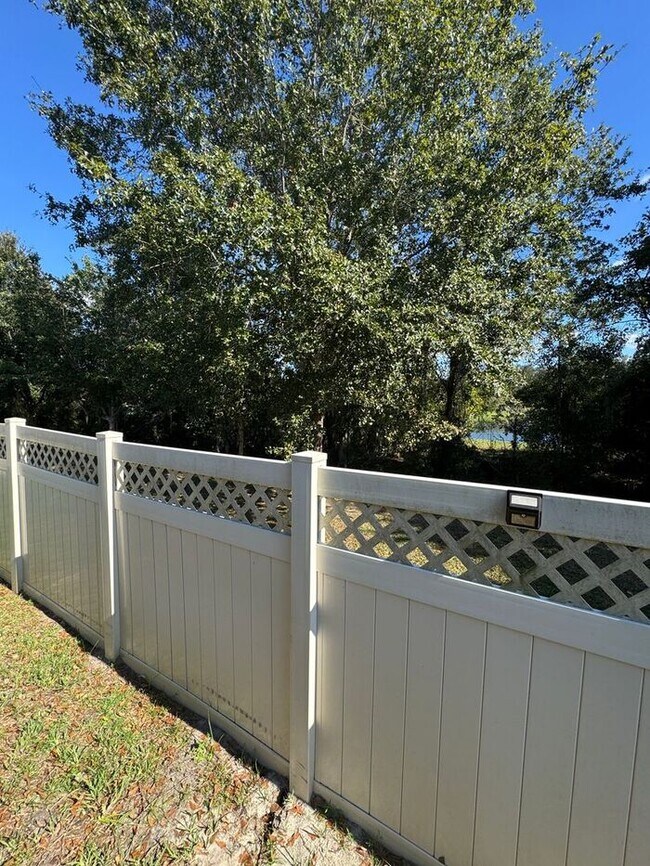 Building Photo - COMING SOON! Beautiful 4BR 3BA Home w/ Screened Lanai & Pond View • Garage Parking • Fenced Yard ...