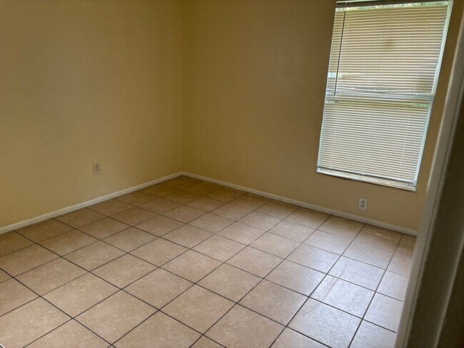 Building Photo - Spacious home on shaded lot off the main path