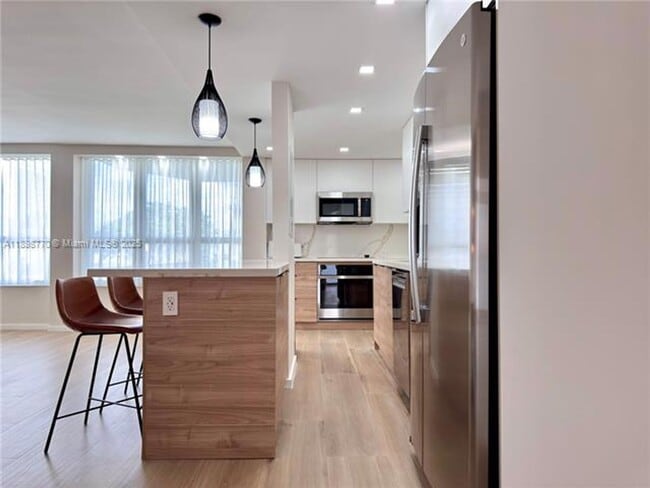 Building Photo - 10230 Collins Ave