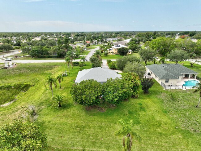 Building Photo - A BOATER'S PARADISE WITH THIS STUNNING 3 BEDROOM, 2 BATH WATERFRONT POOL HOME W/DOCK & BOAT LIFT ...