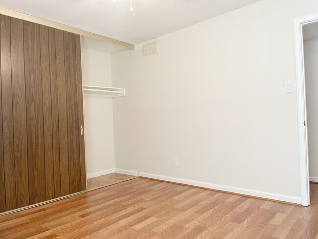 Secondary Bedroom Large Sliding Door Closet - 5550 N Braeswood Blvd