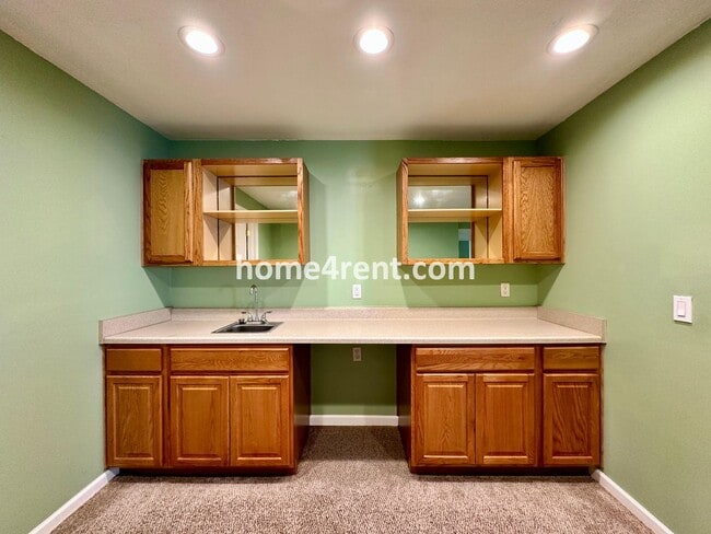 Building Photo - Beautiful Four-Bedroom Home with Three Car Garage, Wood Floors, Finished Basement and a Fenced Ya...