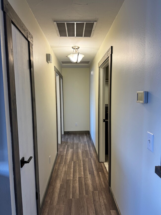 Hallway from living room to shared bath and other bedrooms - 92 E Rosebud Ave