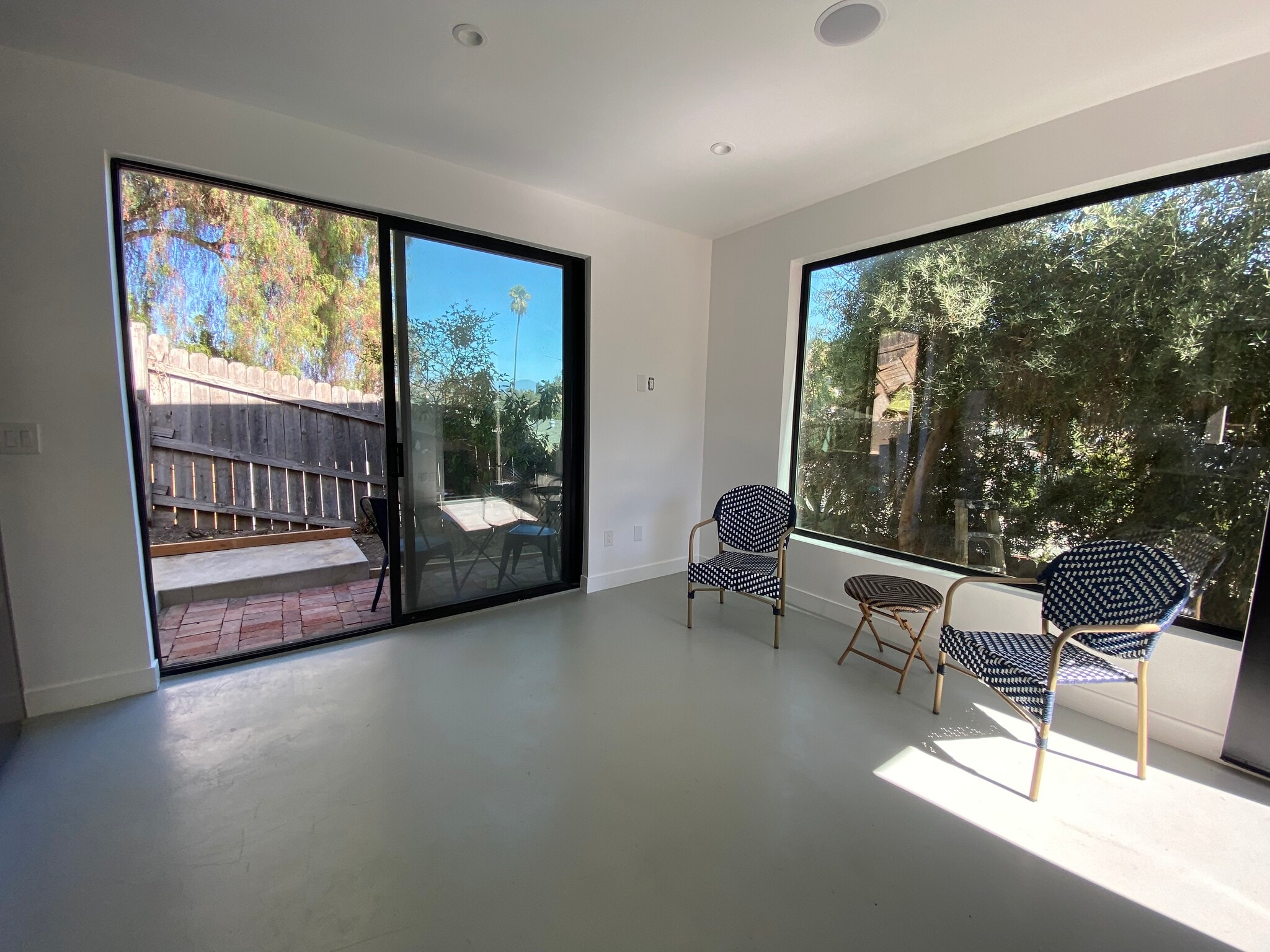 Sliding doors look out onto a clay brick patio. Coffee or wine anyone? - 4435 Radium Dr