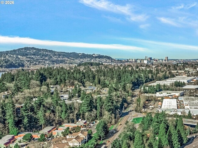 Building Photo - Main Street Living with Granite Kitchen, Gas Fireplace, and MAX Line Access