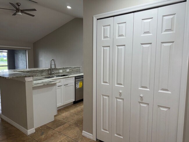 Building Photo - Experience this Cape Coral 3 bedroom 2 bath corner duplex with 1 car garage and screened in lanai.