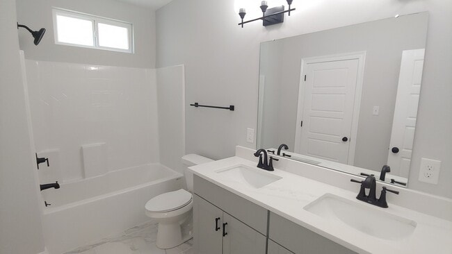 En-suite Master Bathroom with quartz countertops and walk-in closet - 1941 Casa Calvo St