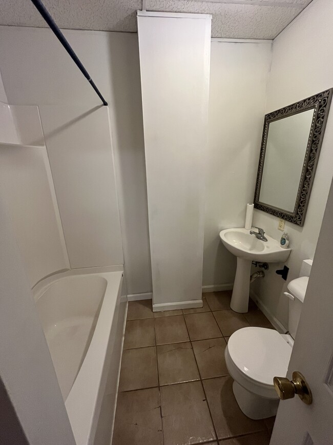 Bathroom with bathtub and shower - 107 E Culton St