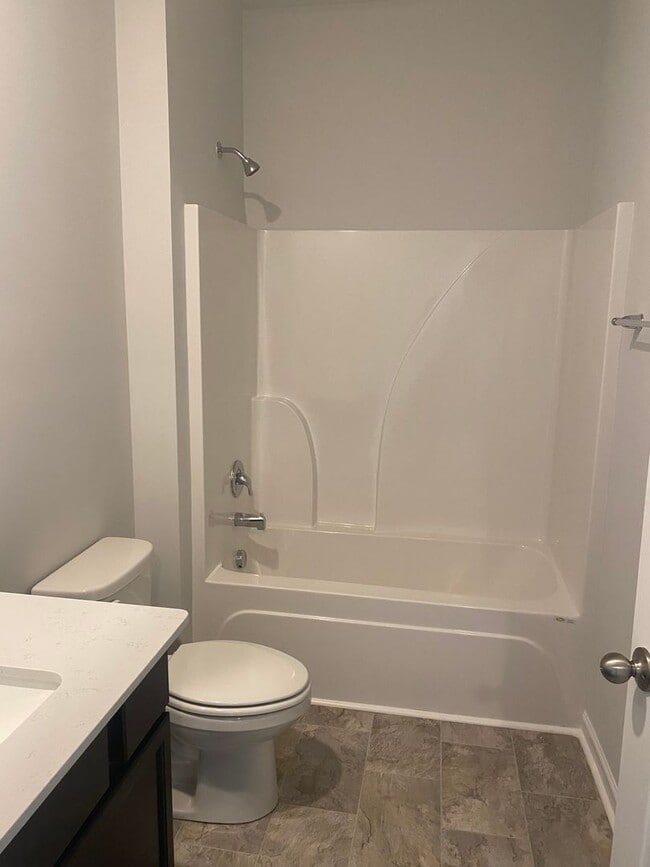 Building Photo - Brand New Construction - 4 bedroom 2 full ...
