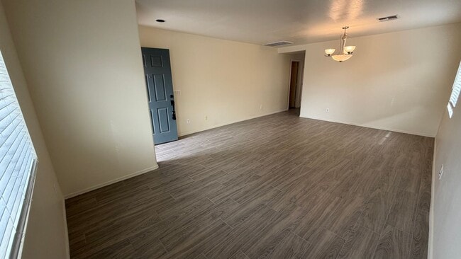 Building Photo - Two Story Home with NEW tile and a large backyard!