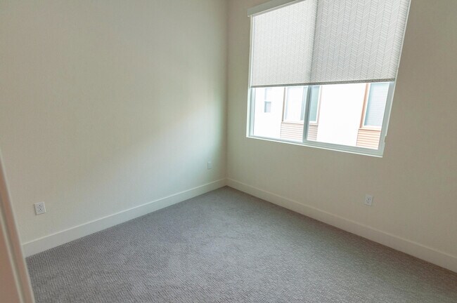 Building Photo - Experience contemporary urban living at its finest. Private Garage & Dual Suites!