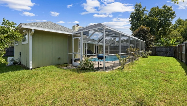 Building Photo - private - backyard fenced in large master suite!