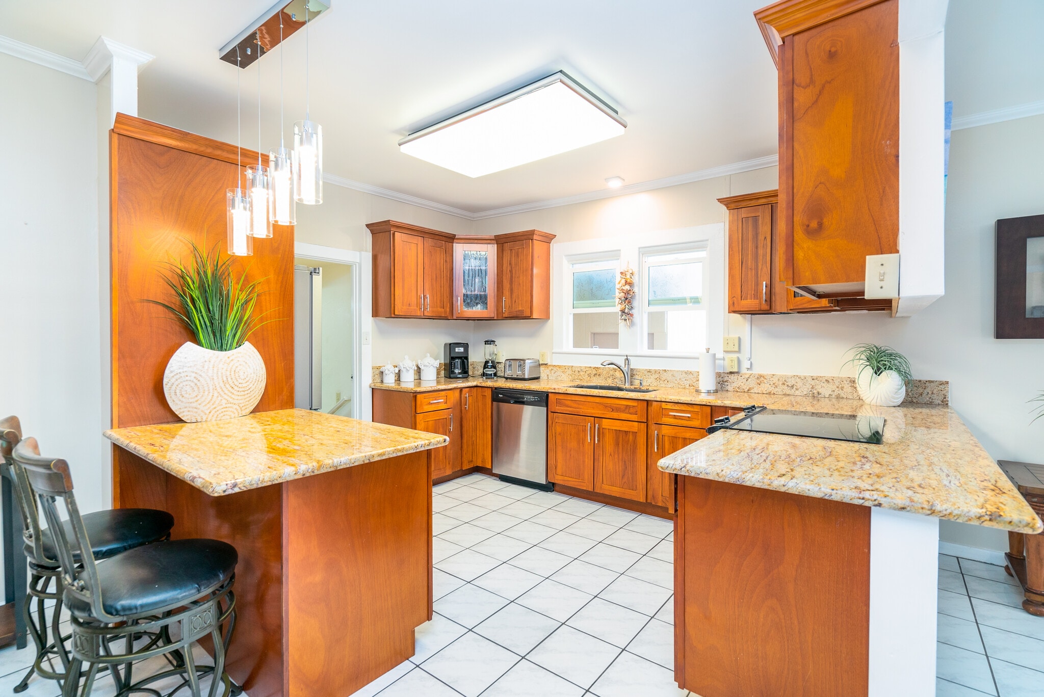 Kitchen with all new stainless steel appliances. Appears bigger in person. - 408 N Kainalu Dr