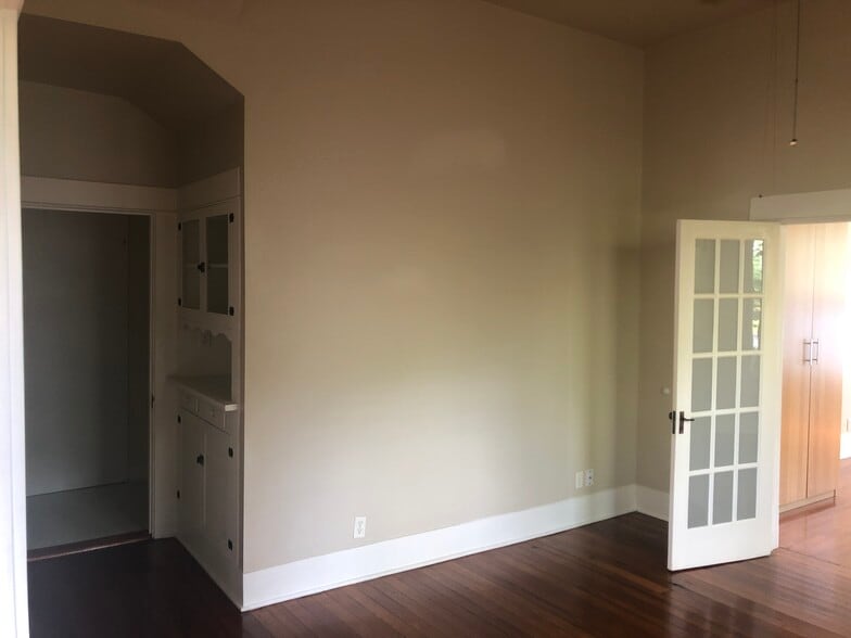 built in china cabin that lets to a large walk in closet extra storage and full size washer and drye - 704 E Guenther St