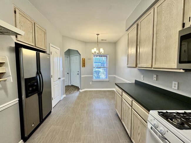 Building Photo - Ready NOW!! A 3-Bedroom Townhome w/Attache...