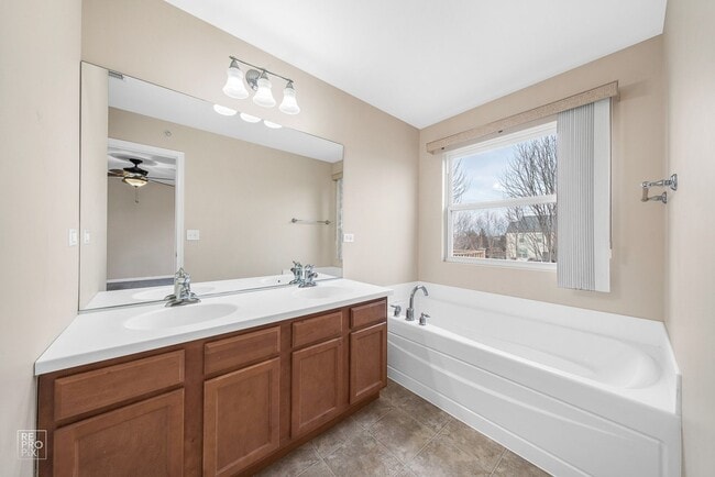 Building Photo - AUTUMN CREEK SECOND FLOOR CONDO WITH TWO CAR GARAGE