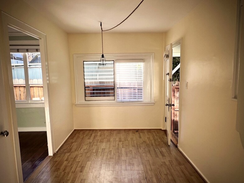 View from Kitchen into Breakfast Area/Front Door - 140 Hart Ave