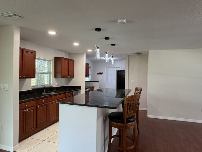 Building Photo - "Charming 3-Bedroom Home with Gleaming Hardwood Floors!"