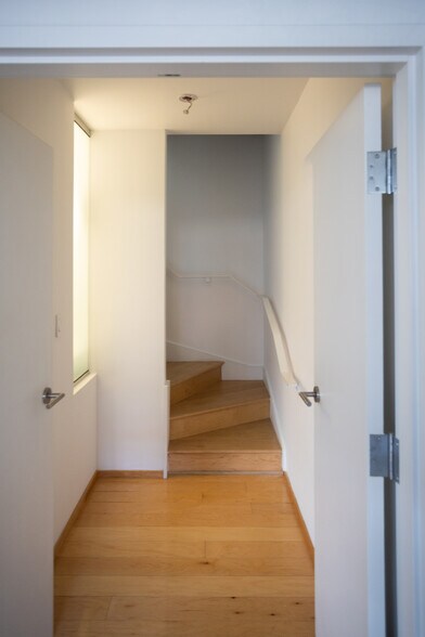 View from the primary bedroom with double doors facing the stairwell. - 2250 11th St NW