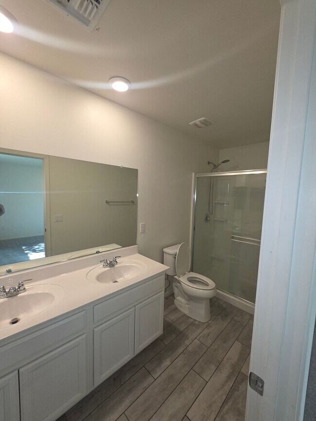 Building Photo - COMING SOON! New 3BR 2 BA Home w/ 2-Car Garage • Stainless Kitchen • Timer-Irrigated Yard in East...