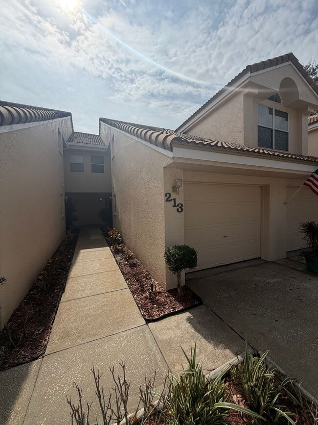 Building Photo - First floor condo in gated East Lake Woodlands of Oldsmar with one car garage