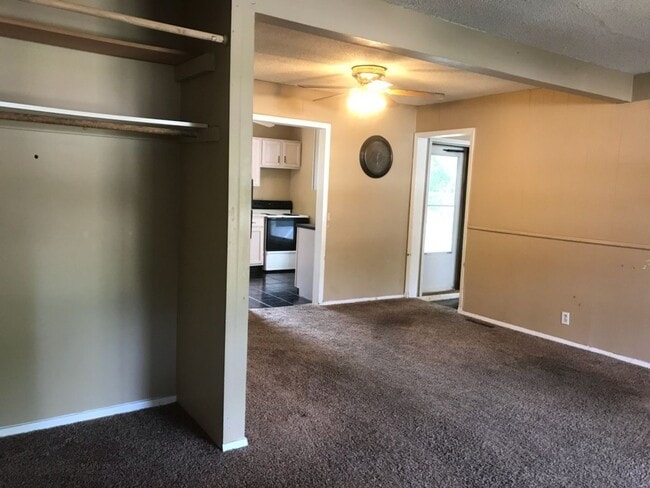 Building Photo - Nice, 4BR rancher with appliances, attached garage and fenced back yard.