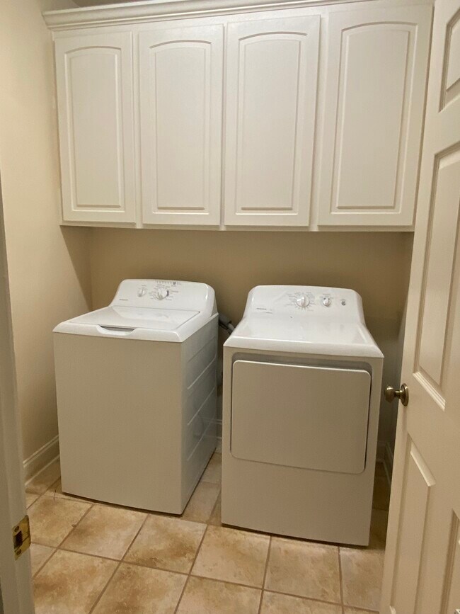 Washer and dryer and cabinets - 308 Thatcher Ln
