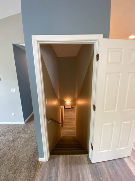 Stairway to lower level - 12 Brookside Cir