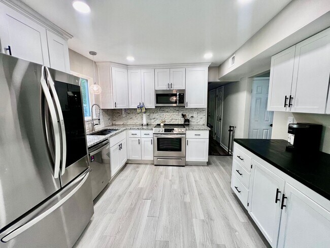 Building Photo - Come see this FULLY renovated two-story tr...