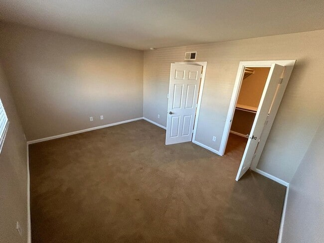 Building Photo - 2 Bedroom 1.5 Bath Townhome. Gated Community. Upgraded & 2 Parking Spaces