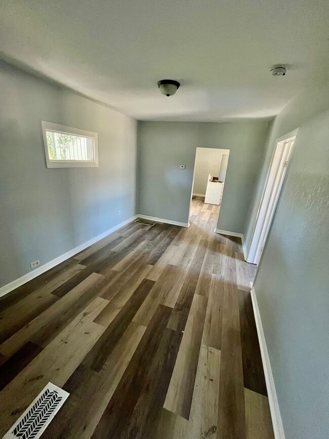 Building Photo - 3BR/1BA with HUGE Backyard, LVT Wood Floor...