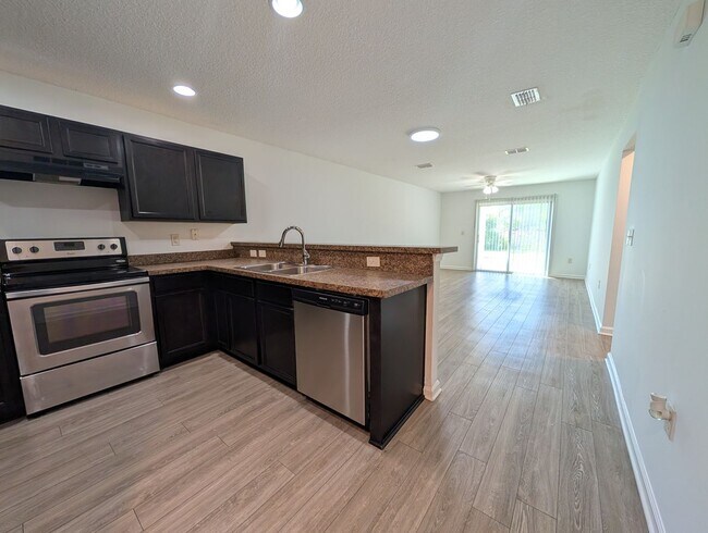 Building Photo - NOW AVAILABLE - 3/2 Duplex on this 12 mo Lease - Conveniently located off Lewis Speedway near St ...