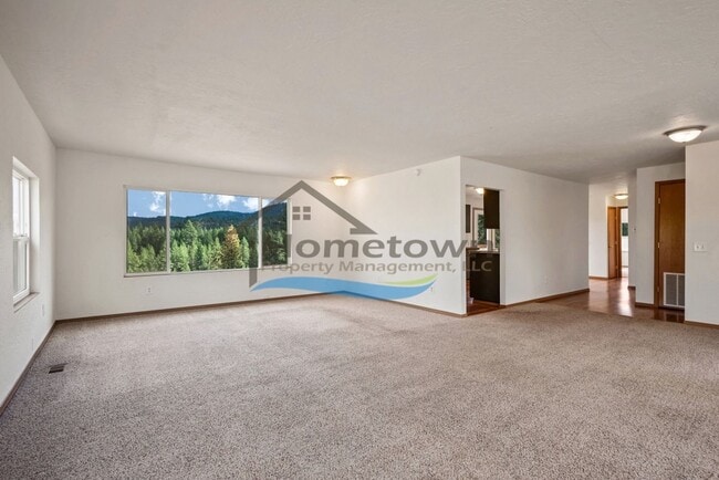 Building Photo - Post Falls Riverfront Home!