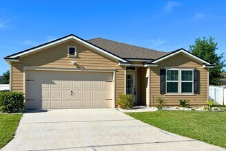 Building Photo - Stylish 4-Bedroom Home with Fenced Yard – ...