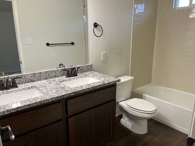 Building Photo - Move Fast! Gated Townhome Near Lackland AFB with Private Yard & EV-Ready Garage