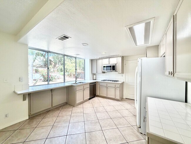 Building Photo - Spacious 5 Bedroom 3 Bathroom Home with Updated Paint, New Roof & Private Balcony