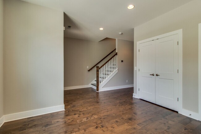 Stairs to living room and hall that leads to a 2 car garage - 707 Vernon Ave