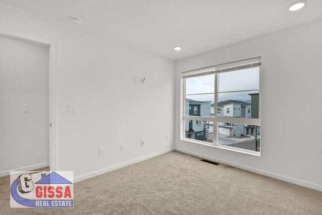 Building Photo - 1.5 year old townhome with 3 bedrooms, 2 1/2 bathrooms, 2-car garage at Victory Ridge available NOW!