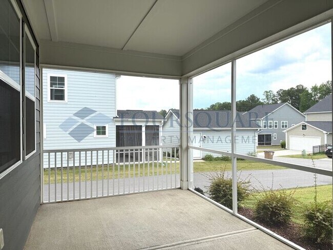 Building Photo - Spacious Corner-Lot Home with Guest Suite, Screened Porch & Detached 2-Car Garage – Resort-Style ...