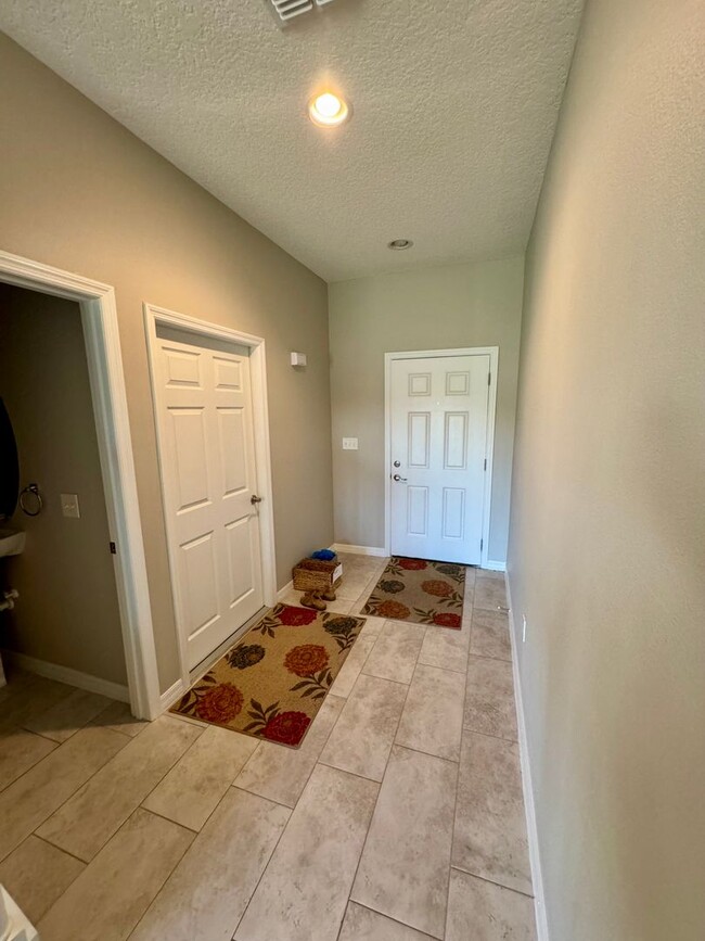 Building Photo - Move in ready 3/2 New Construction Townhou...