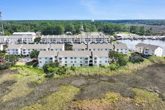 Building Photo - WATERFRONT LIVING! BEAUTIFULLY APPOINTED CONDO ON THE BAYOU IN OS SCHOOL DIST - FULLY FURNISHED