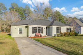 Building Photo - Updated 4 bedroom, 2 bathroom home coming ...