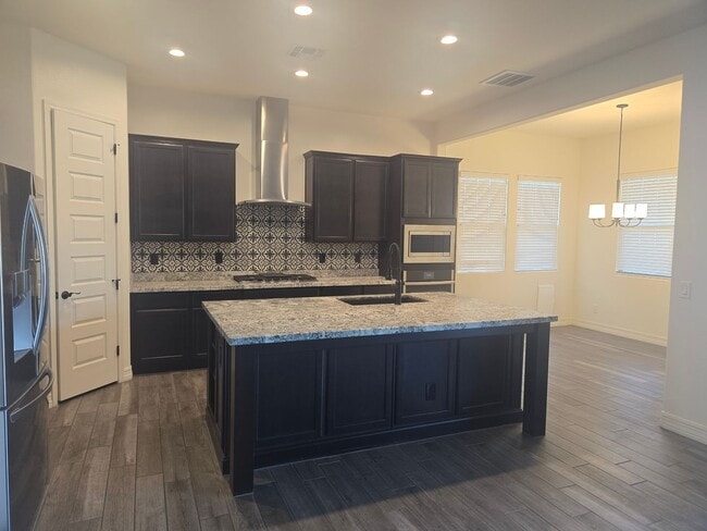 Building Photo - Five-bedroom CASITA home with a three-car ...