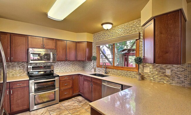 Building Photo - Spacious 4-Bedroom Home with Huge Fenced Y...