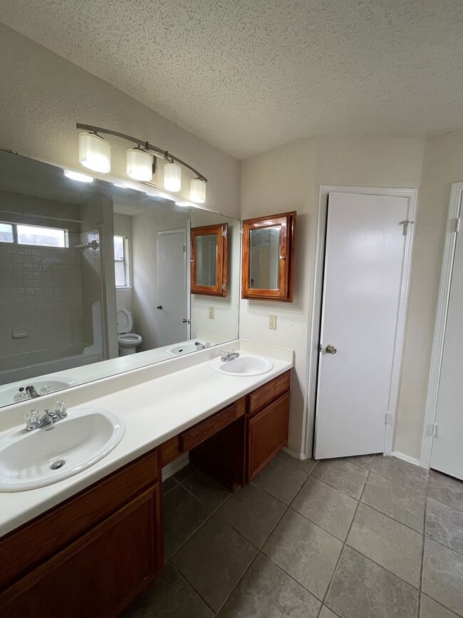 Building Photo - SPACIOUS HOME - NEW FLOORING! - 2 LIVING A...